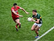30 June 2024; David Clifford of Kerry in action against Christopher McKaigue of Derry during the GAA Football All-Ireland Senior Championship quarter-final match between Kerry and Derry at Croke Park in Dublin. Photo by Piaras Ó Mídheach/Sportsfile