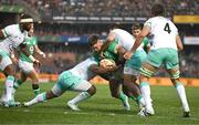 6 July 2024; Andrew Porter of Ireland is tackled by Frans Malherbe and Damian de Allende of South Africa during the first test between South Africa and Ireland at Loftus Versfeld Stadium in Pretoria, South Africa. Photo by Brendan Moran/Sportsfile
