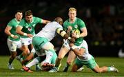 6 July 2024; Jamie Osborne of Ireland is tackled by Bongi Mbonambi of South Africa and Damian de Allende of South Africa during the first test between South Africa and Ireland at Loftus Versfeld Stadium in Pretoria, South Africa. Photo by Brendan Moran/Sportsfile
