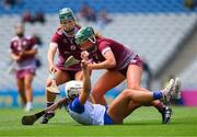 7 July 2024; Roisín Kirwin of Waterford is tackled by Áine Keane, right, and Roisín Black of Galway during the Glen Dimplex Senior Camogie All-Ireland Championship quarter-final match between Galway and Waterford at Croke Park in Dublin.   Photo by Ray McManus/Sportsfile