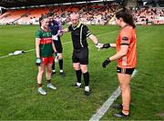7 July 2024; Referee Brendan Rice with team captains Saoirse Lally of Mayo and Clodagh McCambridge of Armagh before the TG4 All-Ireland Ladies Football Senior Championship quarter-final match between Armagh and Mayo at the BOX-IT Athletic Grounds in Armagh. Photo by Piaras Ó Mídheach/Sportsfile