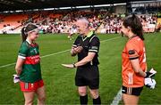 7 July 2024; Referee Brendan Rice performs the coin toss with team captains Saoirse Lally of Mayo and Clodagh McCambridge of Armagh before the TG4 All-Ireland Ladies Football Senior Championship quarter-final match between Armagh and Mayo at the BOX-IT Athletic Grounds in Armagh. Photo by Piaras Ó Mídheach/Sportsfile