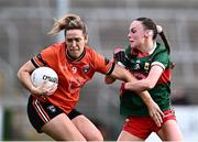 7 July 2024; Caroline O'Hanlon of Armagh in action against Lucy Wallace of Mayo during the TG4 All-Ireland Ladies Football Senior Championship quarter-final match between Armagh and Mayo at the BOX-IT Athletic Grounds in Armagh. Photo by Piaras Ó Mídheach/Sportsfile