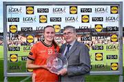 7 July 2024; Blaithín Mackin of Armagh is presented with the Player of the Match award by Hugh Devenney, on behalf of the LGFA, during the TG4 All-Ireland Ladies Football Senior Championship quarter-final match between Armagh and Mayo at the BOX-IT Athletic Grounds in Armagh. Photo by Piaras Ó Mídheach/Sportsfile