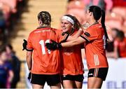 7 July 2024; Armagh players, from left, Aoife McCoy, Lauren McConville and Niamh Henderson celebrate after their side's victory in the TG4 All-Ireland Ladies Football Senior Championship quarter-final match between Armagh and Mayo at the BOX-IT Athletic Grounds in Armagh. Photo by Piaras Ó Mídheach/Sportsfile