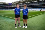 7 July 2024; Referee Rosanna Moloney, Bunscoil Bhóthar na Naomh, Lismore, Waterford, and referee Callum O'Toole, Mount Sion Primary School, Waterford City, Waterford, before the GAA INTO Cumann na mBunscol Respect Exhibition Go Games held before the GAA Hurling All-Ireland Senior Championship Semi-Final between Limerick and Cork at Croke Park in Dublin. Photo by Seb Daly/Sportsfile