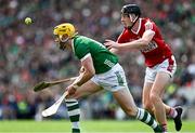 7 July 2024; Seamus Flanagan of Limerick is tackled by Eoin Downey of Cork during the GAA Hurling All-Ireland Senior Championship semi-final match between Limerick and Cork at Croke Park in Dublin. Photo by Ray McManus/Sportsfile
