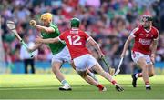 7 July 2024; Tom Morrissey of Limerick in action against Seamus Harnedy, 12, and Mark Coleman of Cork during the GAA Hurling All-Ireland Senior Championship semi-final match between Limerick and Cork at Croke Park in Dublin. Photo by Stephen McCarthy/Sportsfile