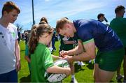 8 July 2024; Gavin Mullin signs autographs during the Team Ireland Paris 2024 team training for Rugby Sevens ahead of the Paris 2024 Olympic Games at the IRFU Outdoor Pitch on the Sport Ireland Campus in Dublin. Photo by Ramsey Cardy/Sportsfile
