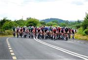 9 July 2024; The peloton during stage one of the 2024 Junior Tour of Ireland at the Maghera stage in Clare. Photo by Stephen McMahon/Sportsfile
