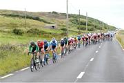 12 July 2024; Conor Murphy of Cycling Ireland team leads the peloton during stage four of the 2024 Junior Tour of Ireland at the Cliffs of Moher stage in Clare. Photo by Stephen McMahon/Sportsfile