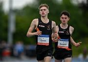 12 July 2024; Sean Cronin of Clonliffe Harriers AC, Dublin, left, after winning the The Jerry Kiernan Foundation Junior Men's Mile ahead of team-mate Lorcan Benjacar who finished second, during the Morton Games at Morton Stadium in Dublin. Photo by Sam Barnes/Sportsfile