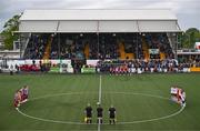 12 July 2024; Players and officials observe a minute of silence for Zara Murphy, who tragically passed away while playing for her club Termonfeckin Celtic in the Louth School Girls Under-14 League last night, before the SSE Airtricity Men's Premier Division match between Dundalk and Drogheda United at Oriel Park in Dundalk, Louth. Photo by Ben McShane/Sportsfile