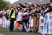 12 July 2024; Ryan O'Kane of Dundalk celebrates with supporters after scoring their side's second goal during the SSE Airtricity Men's Premier Division match between Dundalk and Drogheda United at Oriel Park in Dundalk, Louth. Photo by Ben McShane/Sportsfile