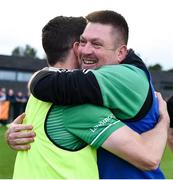12 July 2024; London manager Stephen Lynch celebrates with Felim Conroy after their side's victory in the GAA Football All-Ireland Junior Championship semi-final match between USGAA and London at the GAA National Centre of Excellence in Abbotstown, Dublin. Photo by Shauna Clinton/Sportsfile