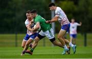 12 July 2024; Brendan Rice of London is tackled by Conor Bradley, left, and Declan Kelly of USGAA during the GAA Football All-Ireland Junior Championship semi-final match between USGAA and London at the GAA National Centre of Excellence in Abbotstown, Dublin. Photo by Shauna Clinton/Sportsfile