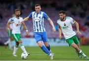 12 July 2024; Ryan Rainey of Finn Harps in action against Conor Drinan of Cork City during the SSE Airtricity Men's First Division match between Cork City and Finn Harps at Turner's Cross in Cork. Photo by Michael P Ryan/Sportsfile