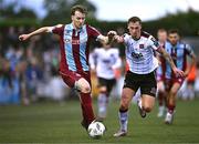 12 July 2024; Andrew Quinn of Drogheda United in action against Scott McGill of Dundalk during the SSE Airtricity Men's Premier Division match between Dundalk and Drogheda United at Oriel Park in Dundalk, Louth. Photo by Ben McShane/Sportsfile