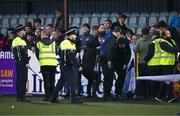 12 July 2024; Members of An Garda Síochána attempt to keep the peace as Drogheda United and Dundalk supporters fight at full-time of the SSE Airtricity Men's Premier Division match between Dundalk and Drogheda United at Oriel Park in Dundalk, Louth. Photo by Ben McShane/Sportsfile