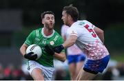 12 July 2024; Alfie McNulty of London is tackled by Shane Bradley of USGAA during the GAA Football All-Ireland Junior Championship semi-final match between USGAA and London at the GAA National Centre of Excellence in Abbotstown, Dublin. Photo by Shauna Clinton/Sportsfile