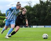 13 July 2024; Izzy Finnegan of DLR Waves in action against Katie Lawlee of Treaty United during the SSE Airtricity Women's Premier Division match between DLR Waves and Treaty United at UCD Bowl in Belfield, Dublin. Photo by Thomas Flinkow/Sportsfile