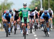 13 July 2024; Max Fitzgerald of Cycling Ireland team  celebrates after winning stage five of the 2024 Junior Tour of Ireland at the East Clare stage in Clare. Photo by Stephen McMahon/Sportsfile