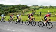 13 July 2024; Aidan Sebel of Ignite Canada team leads the breakaway during stage five of the 2024 Junior Tour of Ireland at the East Clare stage in Clare. Photo by Stephen McMahon/Sportsfile