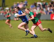 13 July 2024; Abby Reilly of Cavan in action against Emma Higgins of Mayo during the LGFA All-Ireland U16 A Championship final match between Cavan and Mayo at Duggan Park in Ballinasloe, Galway. Photo by Michael P Ryan/Sportsfile