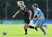 13 July 2024; Katie Lawlee of Treaty United in action against Izzy Finnegan of DLR Waves during the SSE Airtricity Women's Premier Division match between DLR Waves and Treaty United at UCD Bowl in Belfield, Dublin. Photo by Thomas Flinkow/Sportsfile