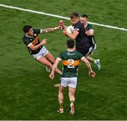 13 July 2024; Rian O'Neill of Armagh in action against Kerry players, left to right, Tony Brosnan, Paul Murphy, and Jason Foley during the GAA Football All-Ireland Senior Championship semi-final match between Armagh and Kerry at Croke Park in Dublin. Photo by Daire Brennan/Sportsfile