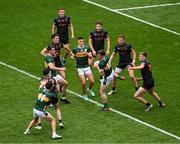 13 July 2024; Cillian Burke of Kerry wins a throw-in ahead of Rian O'Neill of Armagh during the GAA Football All-Ireland Senior Championship semi-final match between Armagh and Kerry at Croke Park in Dublin. Photo by Daire Brennan/Sportsfile