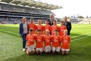 13 July 2024; INTO President Carmel Browne, Uachtarán Chumann Lúthchleas Gael Jarlath Burns, President of Cumann na mBunscol Gary Farrell with the Armagh team, back row, left to right, Maxim Gilmartin, Annaduff NS, Carrick-on-Shannon, Leitrim, Brendan Maguire, St Joseph's NS, Aughavas, Leitrim, Jay Loughlin, St Clare's NS, Manorhamilton, Leitrim, Shane Ryan, Murrintown NS, Murrintown, Wexford, Jude McCoy, St Mary's PS, Maguiresbridge, Fermanagh, front row, left to right, Sean O'Leary, Blackwater NS, Blackwater, Wexford, Donnacha Gormley, Scoil Naomh Éanna, Carroroe, Sligo, Darragh Langan, Corballa NS, Corballa, Sligo, Tommy Muldoon, St Michael's NS, Cloonacool, Sligo, Daniel Maguire, St Macartan's PS, Roslea, Fermanagh, ahead of the GAA INTO Cumann na mBunscol Respect Exhibition Go Games at the GAA Football All-Ireland Senior Championship Semi-Final match between Armagh and Kerry at Croke Park in Dublin. Photo by Daire Brennan/Sportsfile