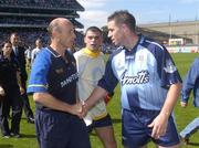 1 August 2004; Roscommon manager Tommy Carr shakes hands with Dublin's Jonathan Magee as team-mate Paul Casey looks on. Bank of Ireland All-Ireland Football Championship, Round 4, Dublin v Roscommon, Croke Park, Dublin. Picture credit; Damien Eagers / SPORTSFILE