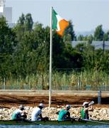 12 August 2004; Ireland's lightweight coxless fours team of, from left, Richard Archibald, Eugene Coakley, Niall O'Toole and Paul Griffin take a break in front of the Irish tricolour after an open training at the Schinias Olympic Rowing Centre. Games of the XXVII Olympiad, Athens Summer Olympics Games 2004, Athens, Greece. Picture credit; Brendan Moran / SPORTSFILE