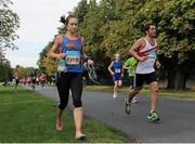 21 September 2013; Felicity Paton, from the United Kingdom, completes the final stages of the race without her runners. Half-marathon Airtricity Dublin race series. Phoenix Park, Dublin. Picture credit: Pat Murphy / SPORTSFILE