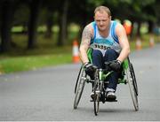 21 September 2013; Wheelchair competitor Turlough Cotter, from Team Carrie, Co. Louth, in action during the half-marathon Airtricity Dublin race series. Phoenix Park, Dublin. Picture credit: Tomás Greally / SPORTSFILE