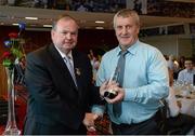 22 September 2013; Uachtarán Chumann Lúthchleas Gael Liam Ó Néill presents former Tyrone All-Star Frank McGuigan with his 'Stars of the 80's' award before the GAA Football All-Ireland Senior Championship Final between Dublin and Mayo, Croke Park, Dublin.  Picture credit: Ray McManus / SPORTSFILE