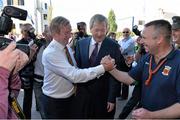 22 September 2013; An Taoiseach Enda Kenny T.D. is greeted by Mayo supporter Shane Fitzgerald, from Kilmaine, Co. Mayo, in the company of Ard Stiúrthoir Paraic Duffy, ahead of the GAA Football All-Ireland Championship Finals, Croke Park, Dublin. Picture credit: Brian Lawless / SPORTSFILE
