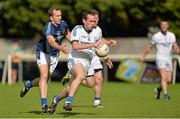 21 September 2013; John O'Malley, Naomh Conaill, Donegal, in action against Michael Pollock, St, Galls, Antrim, during the quarter-final at the 2013 FBD 7s at Kilmacud Crokes GAA Club. The competition, now in its 41st year, attracted top club teams from all over Ireland and provided a day of fantastic football for GAA fans. Kilmacud Crokes GAA Club, Stillorgan, Co. Dublin. Picture credit: Barry Cregg / SPORTSFILE