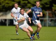 21 September 2013; John O'Malley, Naomh Conaill, Donegal, in action against Michael Pollock, St, Galls, Antrim, during the quarter-final at the 2013 FBD 7s at Kilmacud Crokes GAA Club. The competition, now in its 41st year, attracted top club teams from all over Ireland and provided a day of fantastic football for GAA fans. Kilmacud Crokes GAA Club, Stillorgan, Co. Dublin. Picture credit: Barry Cregg / SPORTSFILE
