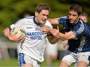 21 September 2013; Mark Gallagher, Naomh Conaill, Donegal, in action against Sean Kelly, St, Galls, Antrim, during the quarter-final at the 2013 FBD 7s at Kilmacud Crokes GAA Club. The competition, now in its 41st year, attracted top club teams from all over Ireland and provided a day of fantastic football for GAA fans. Kilmacud Crokes GAA Club, Stillorgan, Co. Dublin. Picture credit: Barry Cregg / SPORTSFILE