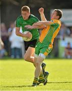 21 September 2013; Sean Donan, Castlewellen, Down, in action against Gary Sice, Corofin, Galway, during the 2013 FBD 7s semi-final at Kilmacud Crokes GAA Club. The competition, now in its 41st year, attracted top club teams from all over Ireland and provided a day of fantastic football for GAA fans. Kilmacud Crokes GAA Club, Stillorgan, Co. Dublin. Picture credit: Barry Cregg / SPORTSFILE
