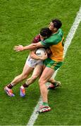 14 July 2024; Kieran Molloy of Galway in action against Michael Langan of Donegal during the GAA Football All-Ireland Senior Championship semi-final match between Donegal and Galway at Croke Park in Dublin. Photo by Daire Brennan/Sportsfile