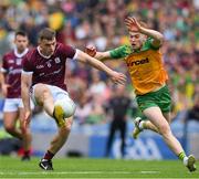 14 July 2024; Liam Silke of Galway shoots past Ciaran Moore of Donegal to score his side's 14th point in the 45th minute,  during the GAA Football All-Ireland Senior Championship semi-final match between Donegal and Galway at Croke Park in Dublin. Photo by Ray McManus/Sportsfile