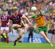 14 July 2024; Liam Silke of Galway shoots past Ciaran Moore of Donegal to score his side's 14th point in the 45th minute,  during the GAA Football All-Ireland Senior Championship semi-final match between Donegal and Galway at Croke Park in Dublin. Photo by Ray McManus/Sportsfile