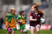 14 July 2024; Caoimhe Flanagan, Scoil Uí Cheithearnaigh, Galway, representing Galway, in action against Sadhbh Ní Eachaí, GS Eiscir Riada, Leacmhcán, Áth Cliath, representing Donegal, during the GAA INTO Cumann na mBunscol Respect Exhibition Go Games at the GAA Football All-Ireland Senior Championship semi-final match between Donegal and Galway at Croke Park in Dublin. Photo by Seb Daly/Sportsfile