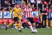 21 July 2024; Cameron Dummigan of Derry City in action against Kian Leavy of St Patrick's Athletic during the Sports Direct Men’s FAI Cup second round match between Derry City and St Patrick’s Athletic at the Ryan McBride Brandywell Stadium in Derry. Photo by Ben McShane/Sportsfile