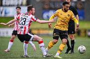 21 July 2024; Jake Mulraney of St Patrick's Athletic in action against Cameron Dummigan of Derry City during the Sports Direct Men’s FAI Cup second round match between Derry City and St Patrick’s Athletic at the Ryan McBride Brandywell Stadium in Derry. Photo by Ben McShane/Sportsfile