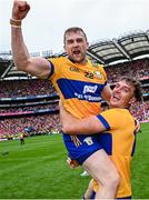 21 July 2024; Clare players Seadna Morey, left, and Peter Duggan celebrate after their side's victory in the GAA Hurling All-Ireland Senior Championship Final match between Clare and Cork at Croke Park in Dublin. Photo by Seb Daly/Sportsfile