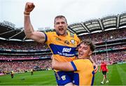 21 July 2024; Clare players Seadna Morey, left, and Peter Duggan celebrate after their side's victory in the GAA Hurling All-Ireland Senior Championship Final match between Clare and Cork at Croke Park in Dublin. Photo by Seb Daly/Sportsfile